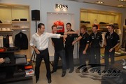 Helio Castroneves shows his moves off to fellow Penske Racing drivers Ryan Briscoe, Sascha Maassen, Pat Long, Romain Dumas and Timo Bernhard